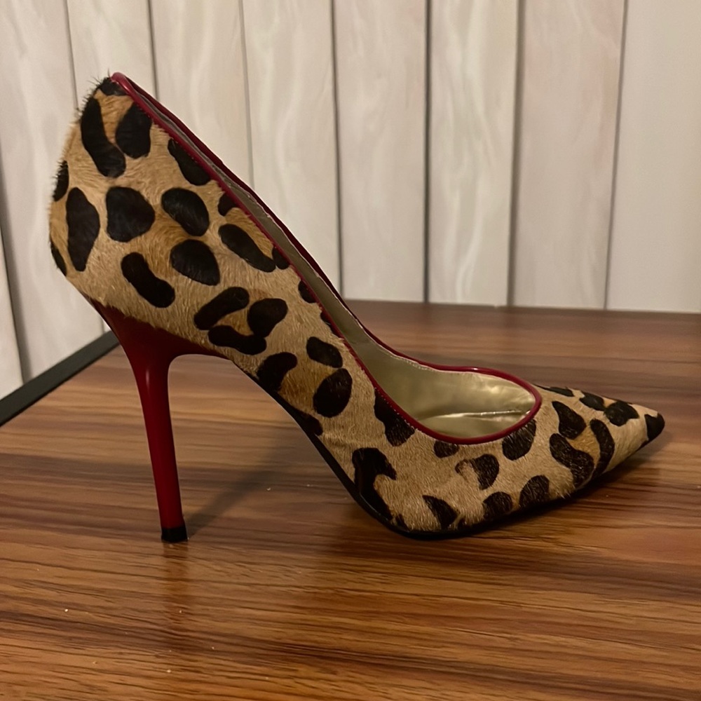 GUESS Animal Print Shoes w/red heel. Gently used, worn once or twice. Size 8.5